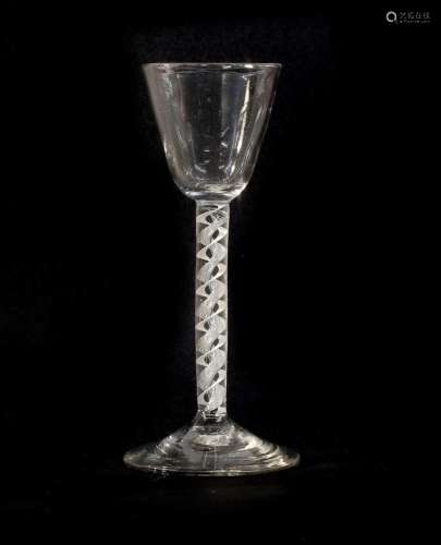 A Wine Glass, circa 1750, the rounded funnel bowl on a mixed...