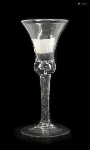 A Wine Glass, circa 1740, the thistle shaped bowl, with basa...