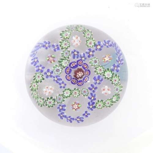 A Baccarat Garlanded Paperweight, circa 1850, the central ca...