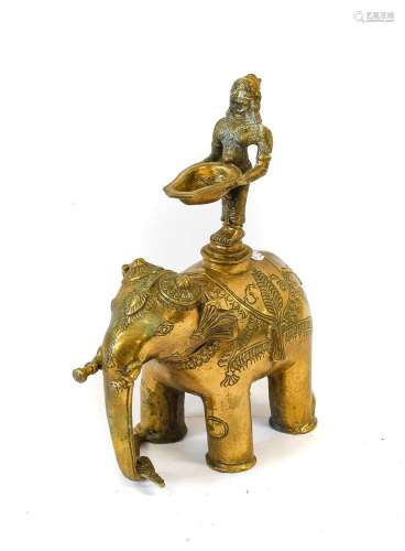 A South-East Asian Bronze Figural Lamp, as a female deity st...