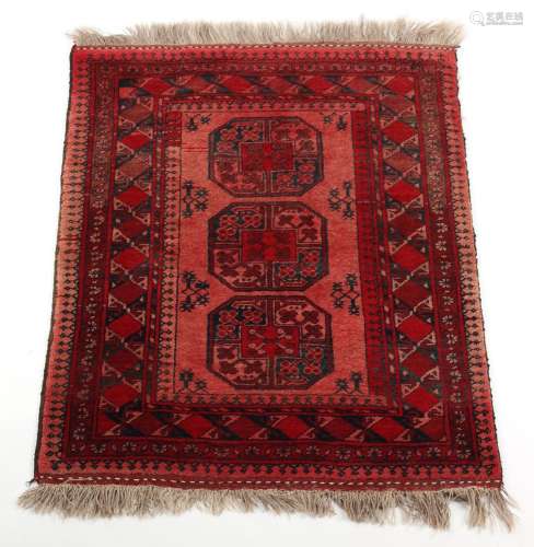 Property of a deceased estate - an Afghan rug, with red grou...