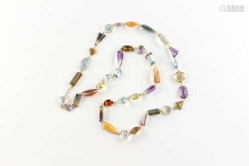 A stylish 18ct yellow gold multi gem set long necklace, with...