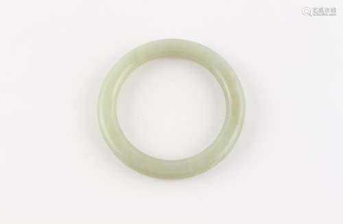 A late 19th / early 20th century Chinese jade bangle, 77mm d...