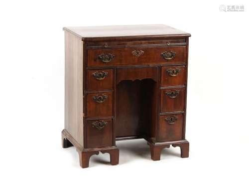 Property of a gentleman - a small walnut kneehole desk with ...