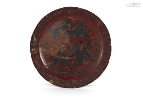 An 18th century Chinese cinnabar lacquer charger, extensivel...