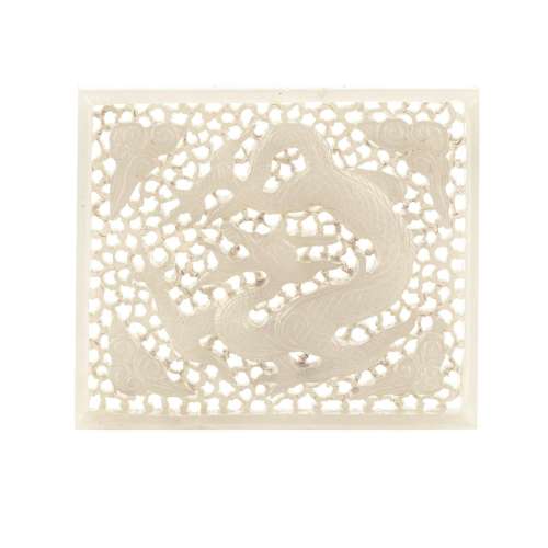 A CARVED AND PIERCED WHITE JADE 'DRAGON' PLAQUE Ming Dynasty