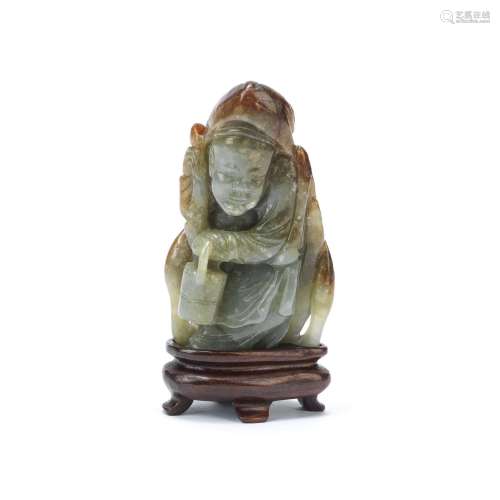 A CELADON AND RUSSET JADE CARVING OF ZHOU TANZI 19th century...