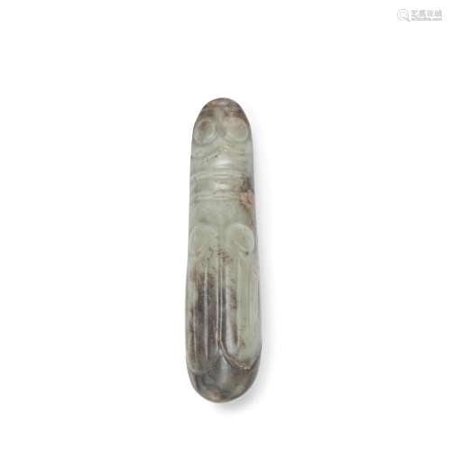 A PALE GREEN AND RUSSET JADE ARCHAISTIC FIGURE OF A CICADA