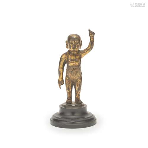 A GILT BRONZE MODEL OF THE STANDING INFANT BUDDHA Ming Dynas...