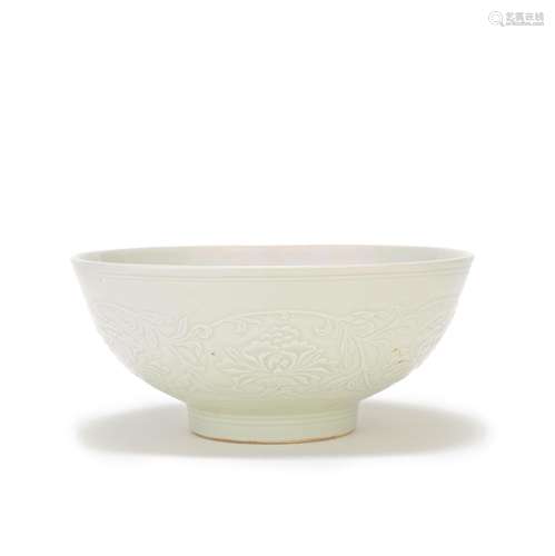 A WHITE GLAZED 'PEONY SCROLL' BOWL 19th century