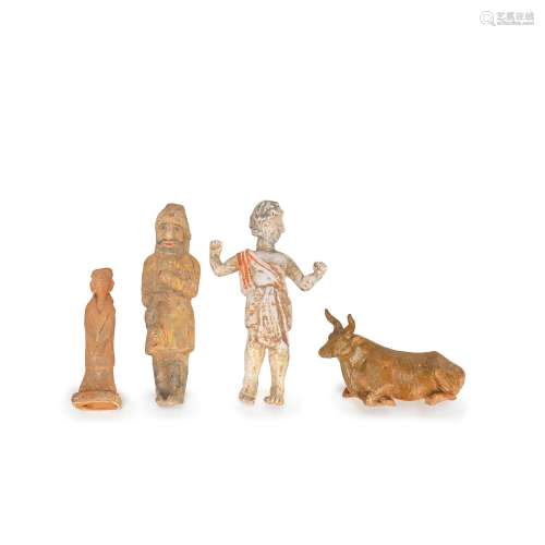 A GROUP OF FOUR EARLY POTTERY FIGURES Han and Tang Dynasty (...