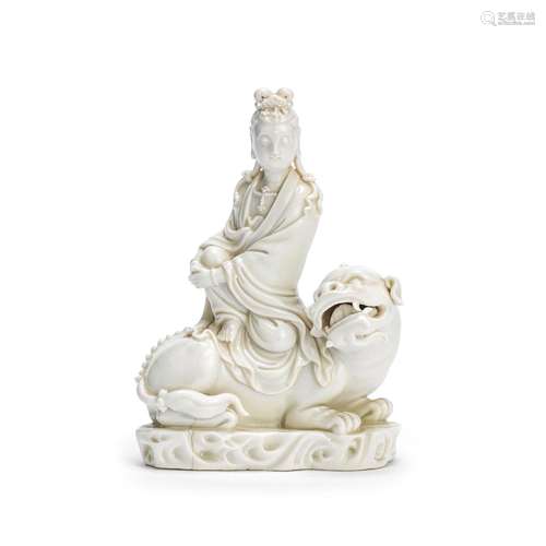 【Y】A BLANC-DE-CHINE FIGURE OF MANJUSHRI SEATED ON A LION 19t...