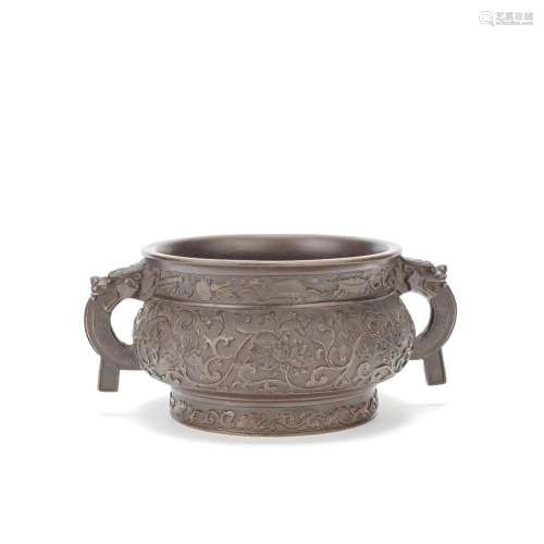 A BRONZE 'LOTUS SCROLL' INCENSE BURNER Probably 17th century...