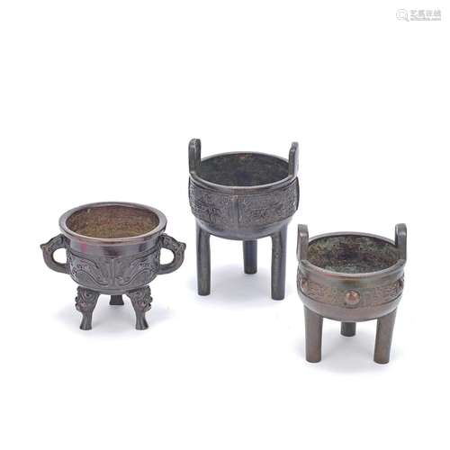 A GROUP OF THREE ARCHAISTIC TRIPOD  BRONZE INCENSE BURNERS X...