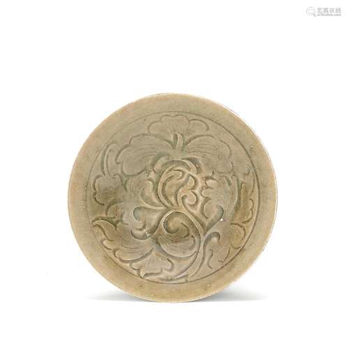 A CARVED YAOZHOU CELADON-GLAZED 'PEONY' BOWL Northern Song/J...