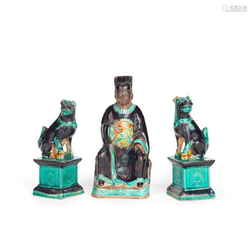 A FAHUA-GLAZED FIGURE OF A SCHOLAR AND A PAIR OF BUDDHIST LI...