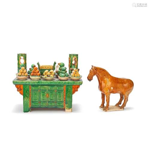 A SANCAI-GLAZED OFFERING TABLE AND AN OCHRE-GLAZED MODEL OF ...