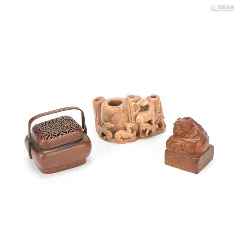 A BRONZE HANDWARMER AND COVER, A SOAPSTONE WATER POT AND AN ...