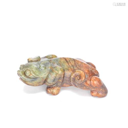 A GREEN AND RUSSET JADE CARVING OF A MYTHICAL BEAST 20th Cen...