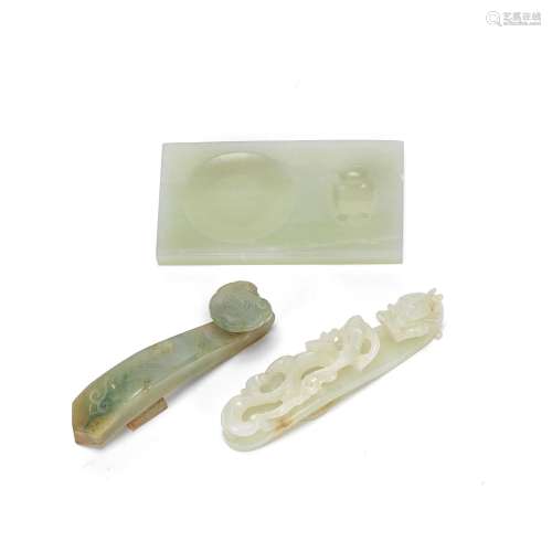 TWO JADE BELT HOOKS AND A JADE INKSTONE 18th century or late...