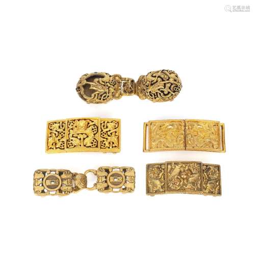 FIVE BRONZE AND GILT BRONZE SETS OF BELT HOOKS AND BUCKLES Q...