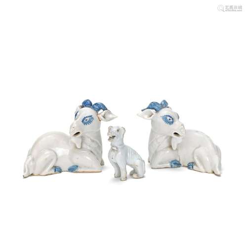 【*】A PAIR OF BLUE AND WHITE MODELS OF RECUMBENT RAMS AND A W...