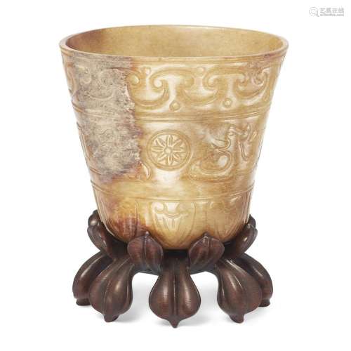 A Chinese mottled creamy and mushroom jade archaistic cup<br...