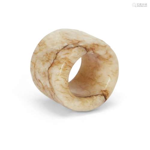 A Chinese 'chicken bone' jade thumb ring<br />
<br />
Qing d...