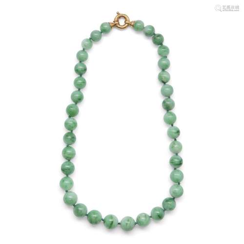 A Chinese apple-green jadeite bead necklace<br />
<br />
Rep...