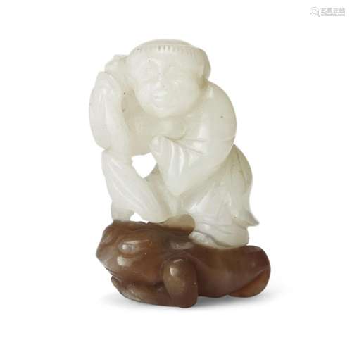 A Chinese white and brown jade two-tone carving of Liu Hai <...