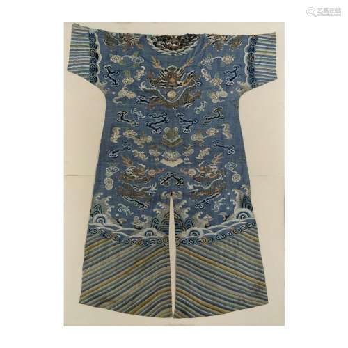 A Chinese silk embroidered blue ground 'dragon' robe back se...