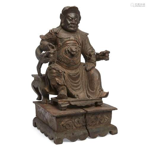 A large Chinese gilt-lacquered wood figure of Guandi<br />
<...