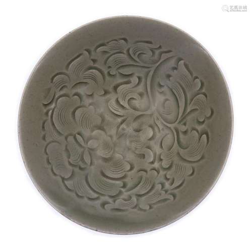 A Chinese Yaozhou-type celadon-glazed carved bowl<br />
<br ...