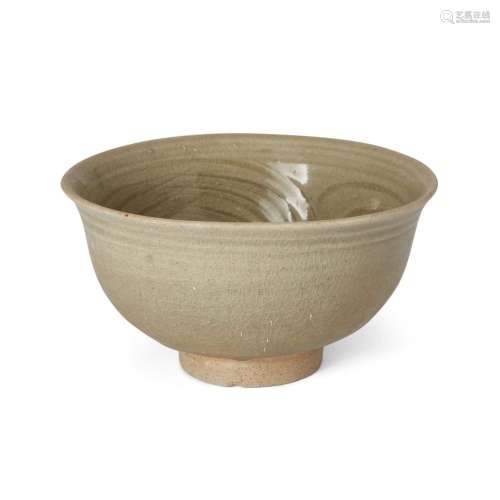 A Chinese carved celadon-glazed stoneware bowl<br />
<br />
...