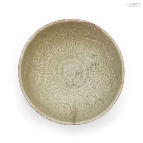 A Chinese Longquan celadon-glazed moulded bowl<br />
<br />
...