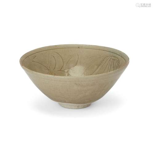 A Chinese carved celadon-glazed bowl<br />
<br />
Ming dynas...