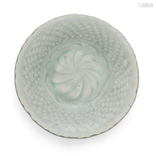 A Chinese celadon-glazed carved plate<br />
<br />
Yuan/Ming...