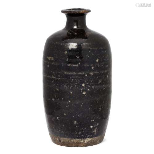 A Chinese black-glazed ribbed bottle vase<br />
<br />
Ming ...