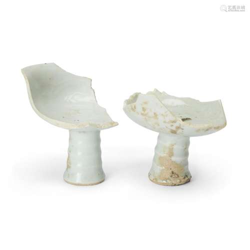 A pair of Chinese qingbai-glazed moulded 'dragon' stem cup s...