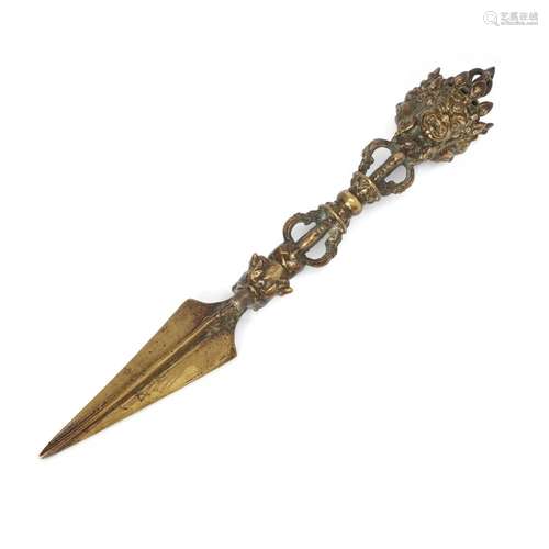 A Tibetan ritual gilt bronze three-sided peg, Phurba/Vajrakī...