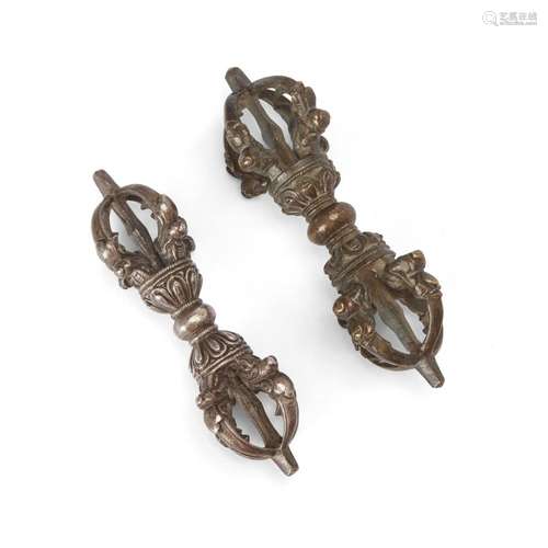 Two Tibetan white metal and copper alloy five-pronged vajra<...