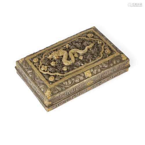 A Tibetan parcel-gilt white metal 'dragon' box<br />
<br />
...