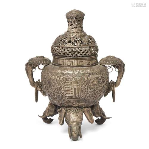 A Tibetan white metal repoussé elephant feet incense burner ...