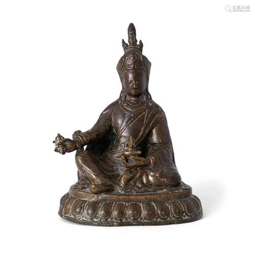 A Tibetan gilt bronze sculpture of Padmsambhava<br />
<br />...