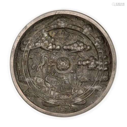 A Japanese bronze 'cranes and pine' circular mirror<br />
<b...