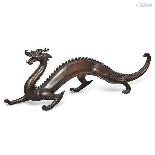 A large Japanese bronze dragon okimono by the Sekiya Company...