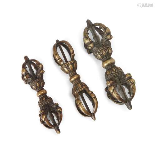 Three Tibetan bronze five-pronged vajras <br />
<br />
Circa...