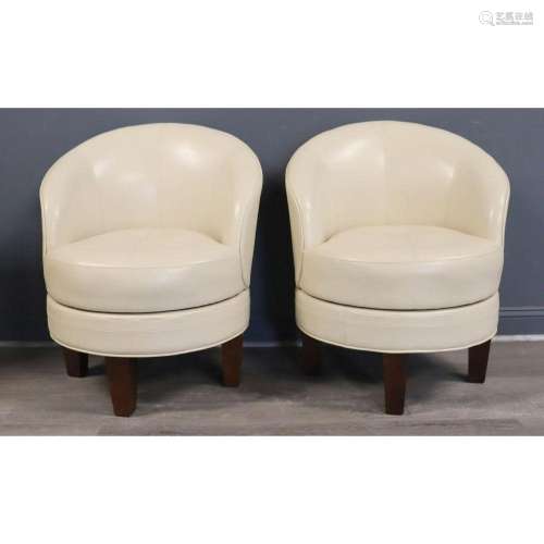A Modern Pair Of Leather Upholstered Swivel Chairs