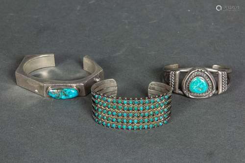 Three Navajo turquoise and sterling cuff bracelets, one mark...