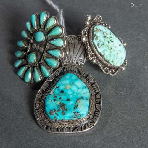 Two Navajo turquoise mounted silver rings together with a tu...